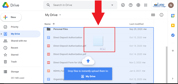 screenshot of file being dragged into google drive window