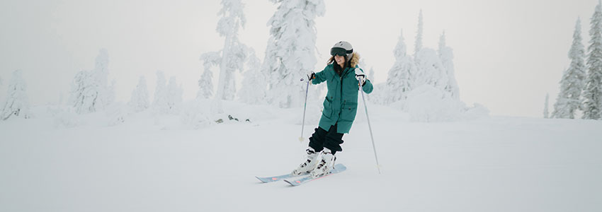 Girl skiing in whiteout conditions