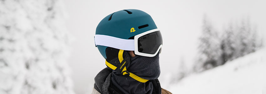 Guy in snow wearing Retrospec Comstock Snow Helmet