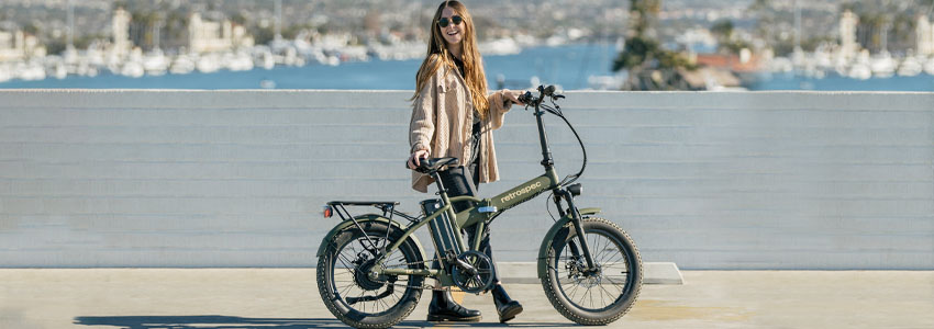 Girl with Retrospec Jax Rev Folding Electric Bike near water