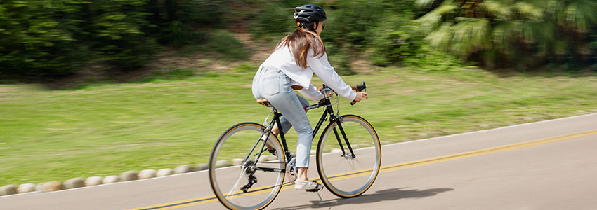 Girl riding Retrospec Culver road bike on the road 