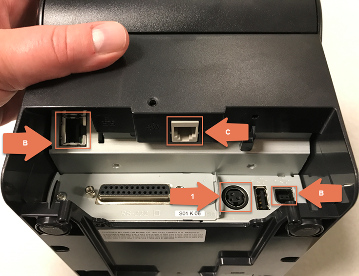 Photo with arrow with the number one pointing to round power plug in. Arrows with the letter B pointing to the USB plug ins, arrow with the letter C pointing to the port for the cash drawer.