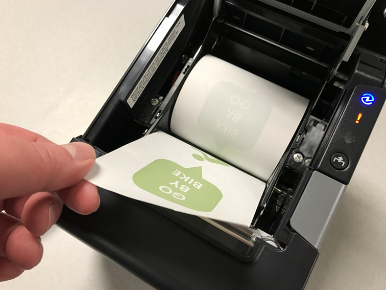 Photo of the receipt paper feeding out of the printer