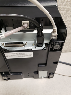 Photo of the back of the printer with three wires plugged in