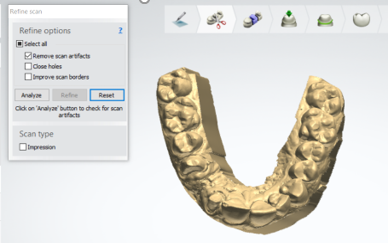 A gold object with teeth

Description automatically generated