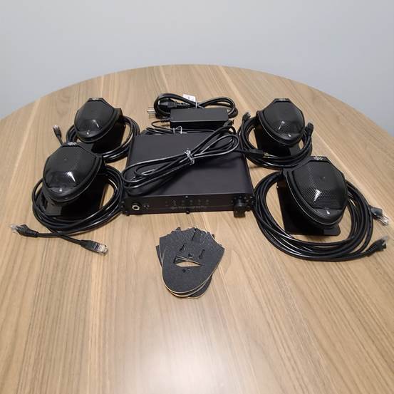 A set of headphones on a table

Description automatically generated with medium confidence